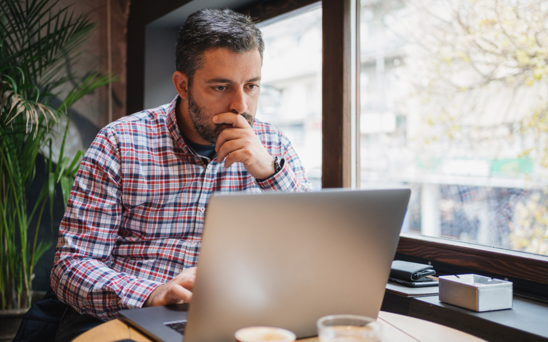 Business owner planning a premium sale strategy with documents and financial charts for 2025.
